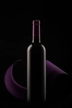 Bottle of red wine on a black background Stock Photos
