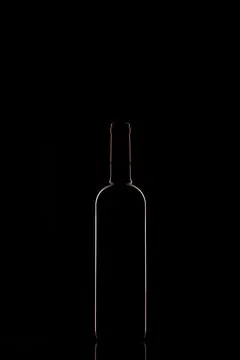 Bottle of red wine on a black background Stock Photos