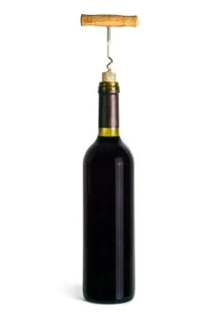 A bottle of red wine open with a corkscrew Stock Photos