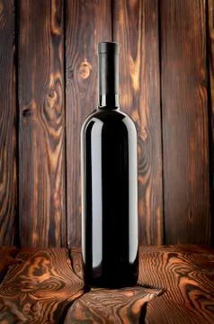 Bottle of red wine on the table Stock Photos