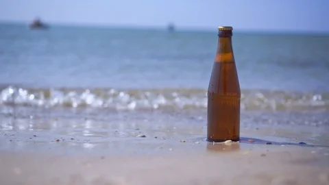 A bottle of refreshing beer on the beach Stock Footage 114953259