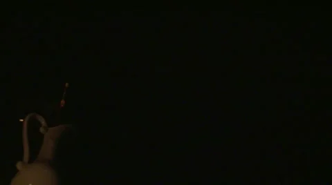 Bottle rocket launching at night, slow motion Stock Footage 61941037