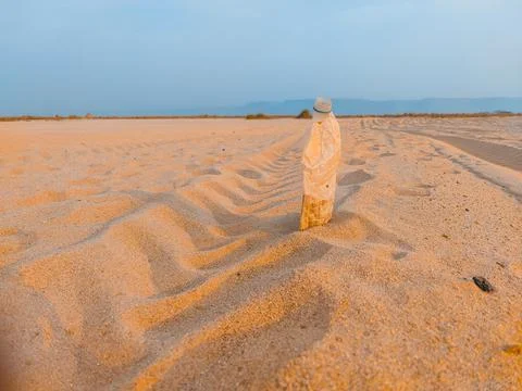 A bottle in sand fields Stock Photos