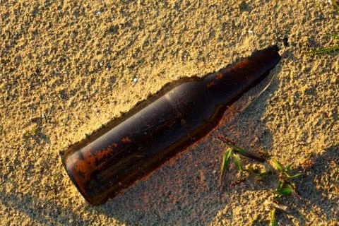 Bottle on Sand Stock Photos