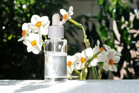 A bottle of serum with a dropper. Stock Photos