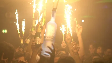Bottle Service with Sparklers Heading to Table at Nightclub Stock Footage