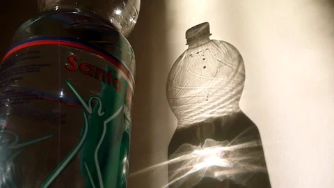 Bottle shadow on the wall Stock Footage 99216506