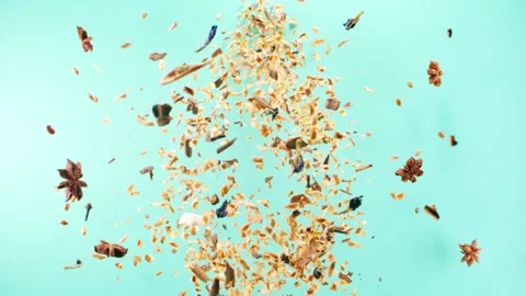 Bottle shape spices explosion on blue Stock Footage 145792070