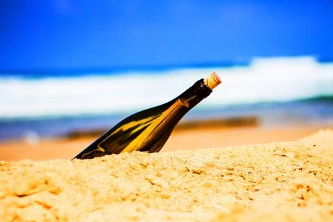 Bottle on the shore Stock Photos
