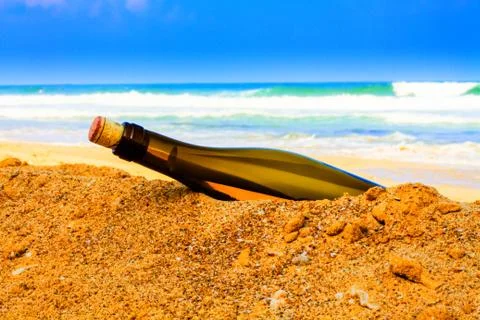 Bottle on the shore Stock Photos