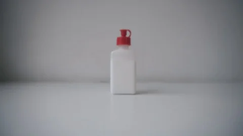 Bottle of some product on white background dolly forward move. Stock Footage 96331694