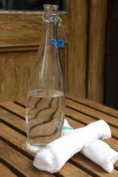 A bottle of table water with two napkins Stock Photos