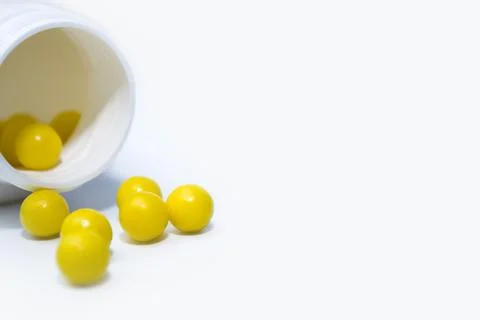Bottle with tablets in the form of capsules on a white background Stock Photos