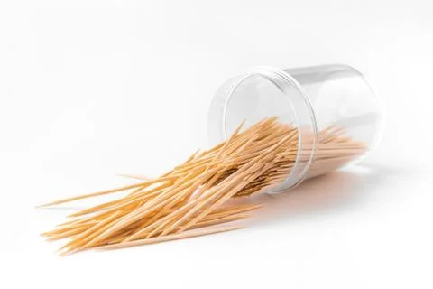 Bottle with toothpicks on a white background. The toothpick falls, crumbles,  Stock Photos