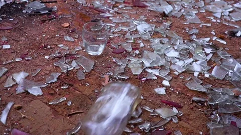 Bottle with vodka falls to the floor Stock Footage 80846608