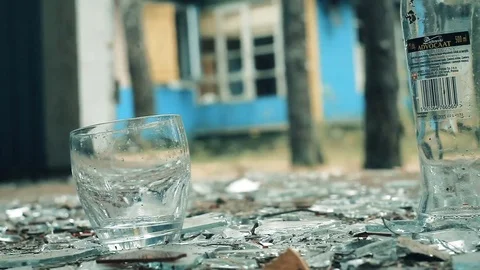 A bottle of vodka falls to the floor Stock Footage 81700967