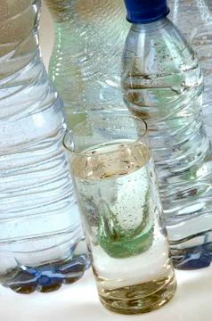 Bottle of water on gray background Stock Photos