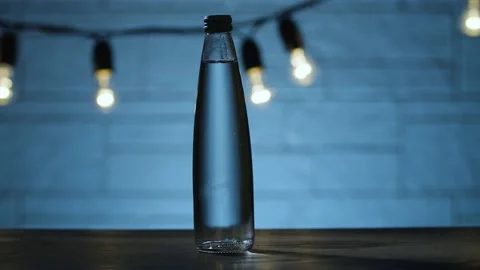 Bottle of water on the table Stock Footage 143095916