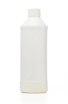 Bottle of white liquid on a plain background, emphasizing simplicity and mi.. Stock Photos