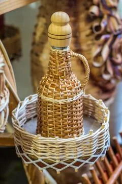 Bottle in Wicker decorations Stock Photos