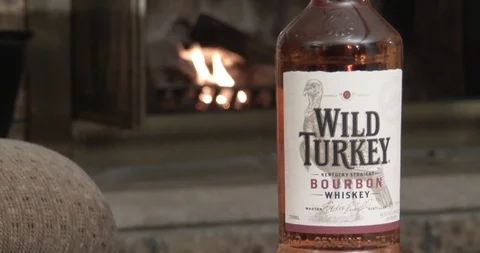 Bottle Of Wild Turkey Bourbon - Fireplace Stock Footage 123496147