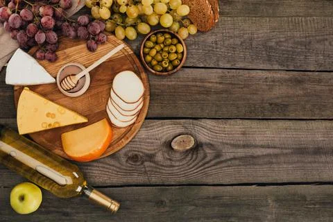 Bottle of wine and cheese Stock Photos