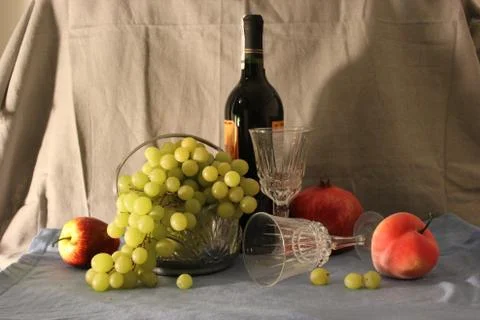 A bottle of wine and fruit. Stock Photos