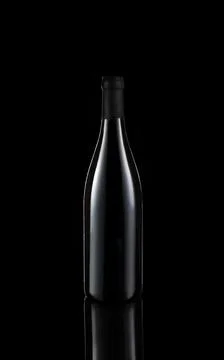 Bottle of wine on black background with reflection Stock Photos