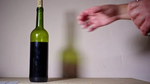 Bottle of wine with corkscrew for gastronomy Stock Footage 232770145