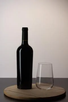 Bottle of wine with an empty glass Stock Photos