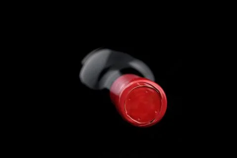 Bottle of wine lying down on a dark background Foto stock