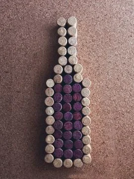 Bottle of wine made of corks on the background of a cork surface. Stock Photos