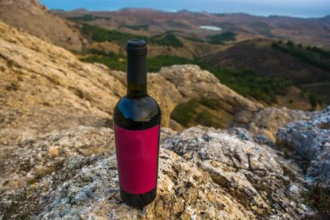 A bottle of wine in the mountains Stock Photos