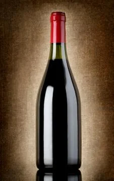 Bottle of wine on the old background Stock Photos