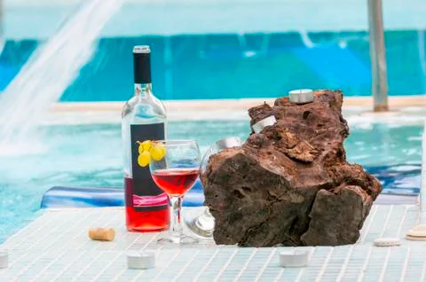 Bottle of wine in poolside Stock Photos