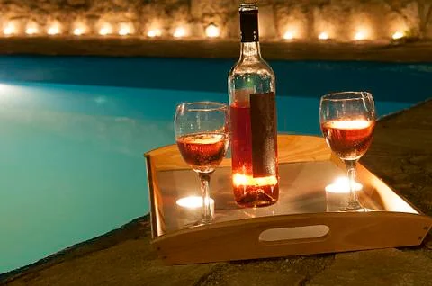 Bottle of wine at poolside Stock Photos