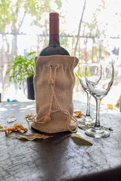A bottle of wine ready to serve at the table Stock Photos
