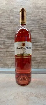 A bottle of wine on a table Stock Photos