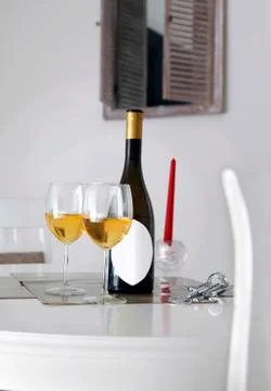 A bottle of wine with two glasses on the table Stock Photos
