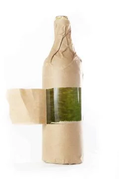 Bottle wrapped in paper bag Stock Photos