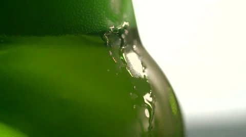 Bottled Beer and Falling Foam Bubbles 1 Stock Footage 53037600