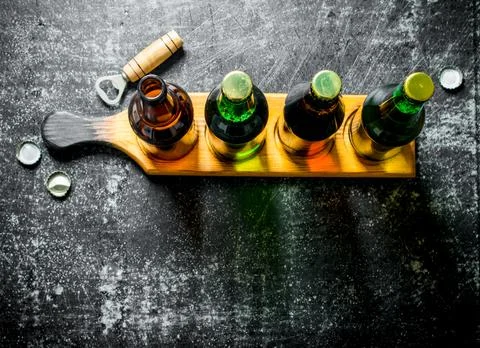 Bottled beer on the stand. Stock Photos
