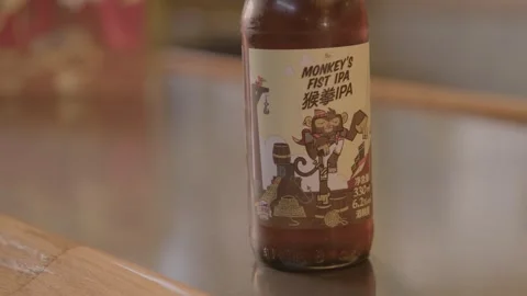 Bottled Beverage with Illustrated Label on Bar Counter in Beijing, China Stock Footage 345759434