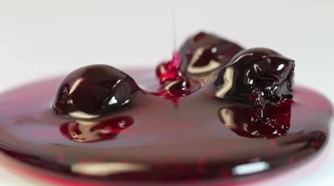 Bottled cherry jam on a white background Stock Footage 8521111