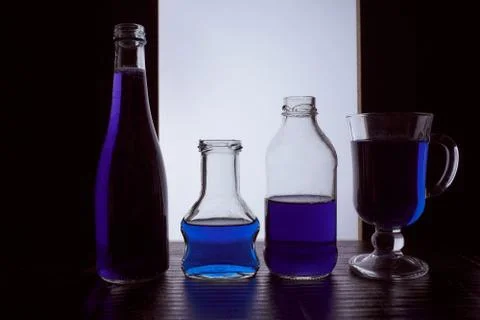 Bottled on a light background with blue liquid Stock Photos