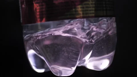 Bottled liquid water in slow motion Stock Footage 237265557