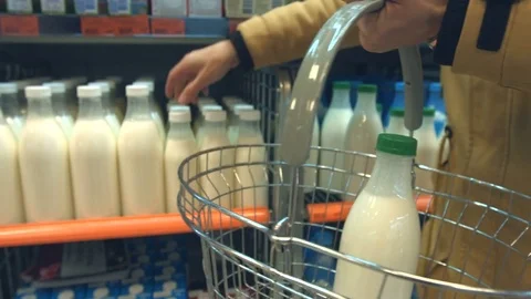 Bottled milk on the shelf in the store. Video stock 83827070