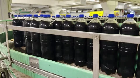Bottled Soft Drinks Moving Through Industrial Filling Line Stock Footage 334969205