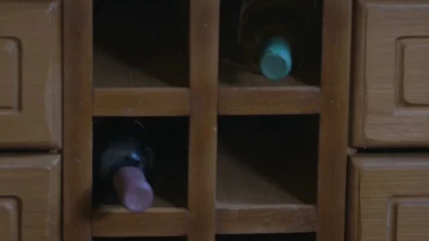 The bottled wine is stored in the table in the kitchen. Camera motion slider Stock Footage 70687384