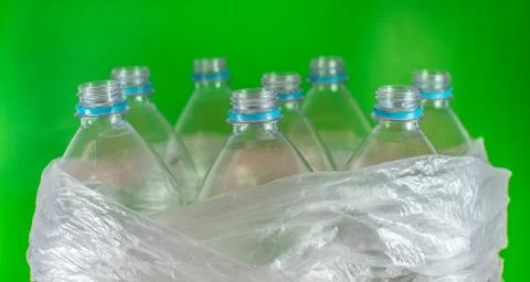 Bottlenecks of a pack of 8 empty and recyclable plastic water bottles, with n Stock Photos